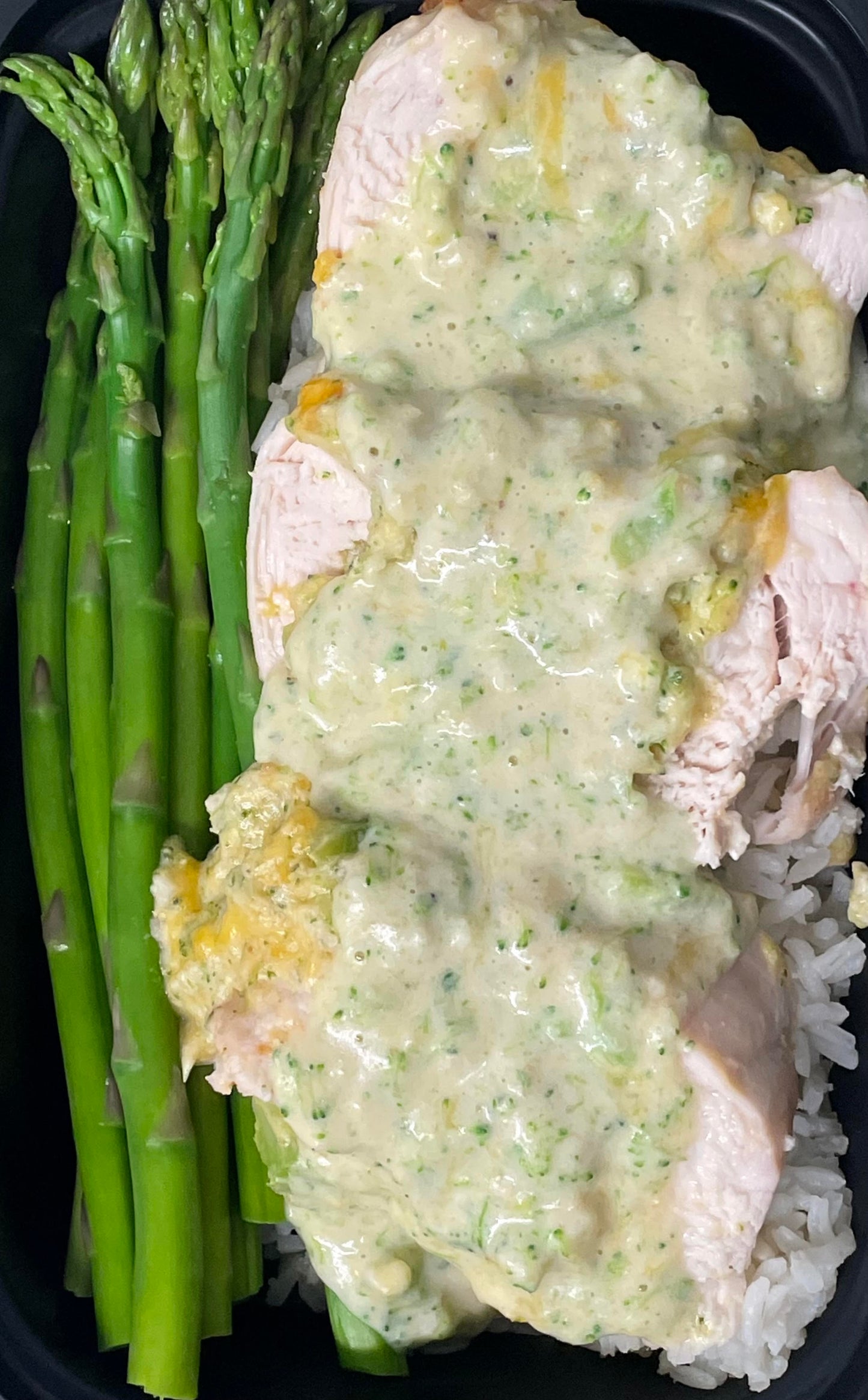 Broccoli and Cheese Stuffed Chicken with Steamed Asparagus