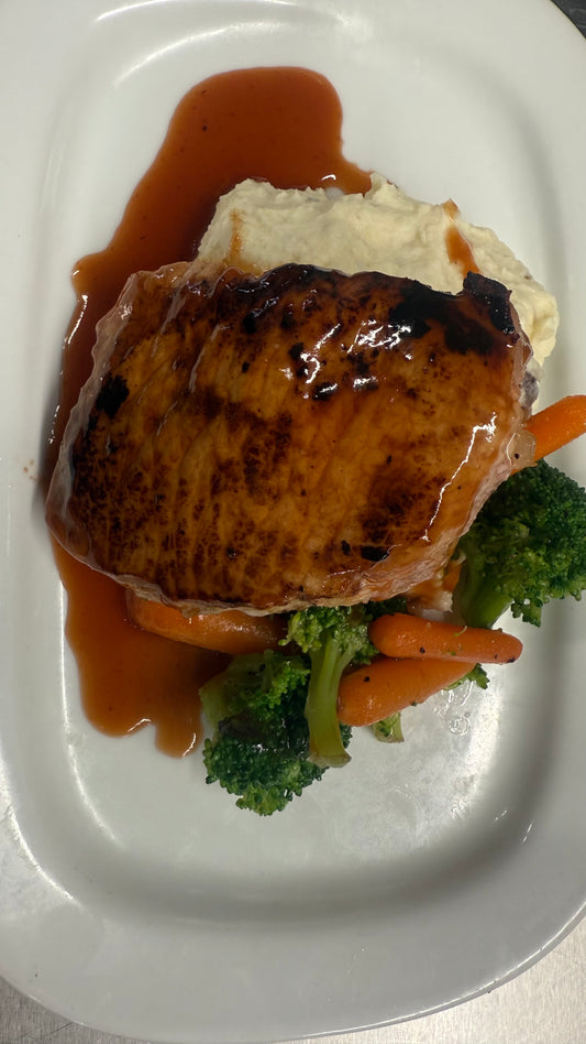 Orange Barbeque-Glazed Porkchop with Mashed Potatoes and Steamed Carrots and Broccoli